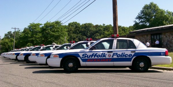 a group of Suffolk County police cars